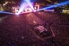 A drone shot of a festival crowd and stage